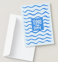 Card with 'Seas the Day' text and wavy lines on a light blue background